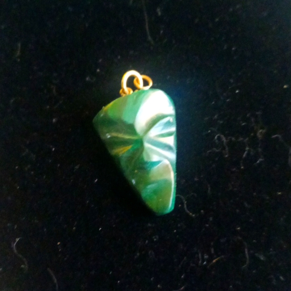 Malachite mask pendant.